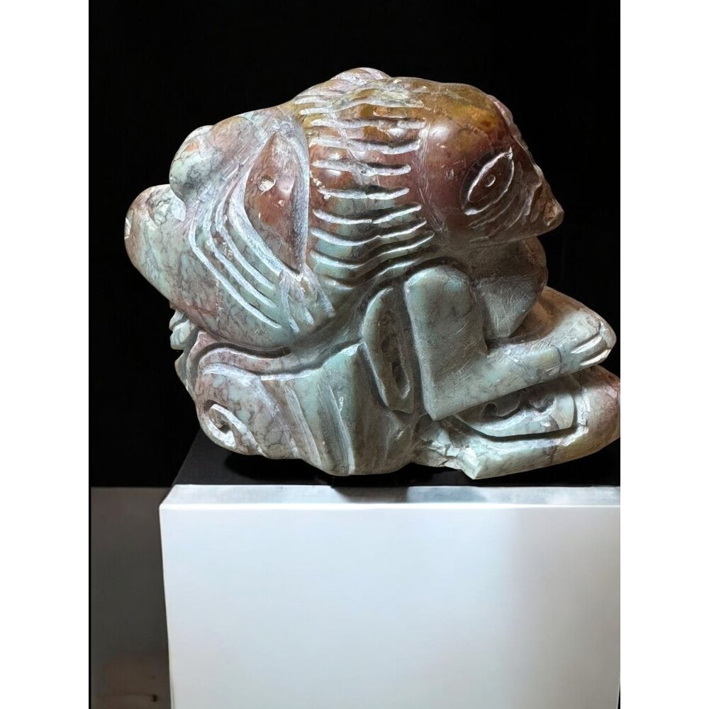 Hand-Carved Abstract Stone Figurine With Tribal Face Design